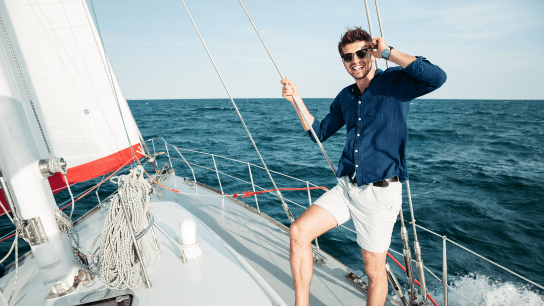 Man on a boat smiling while wearing reliefband to treat motion sickness