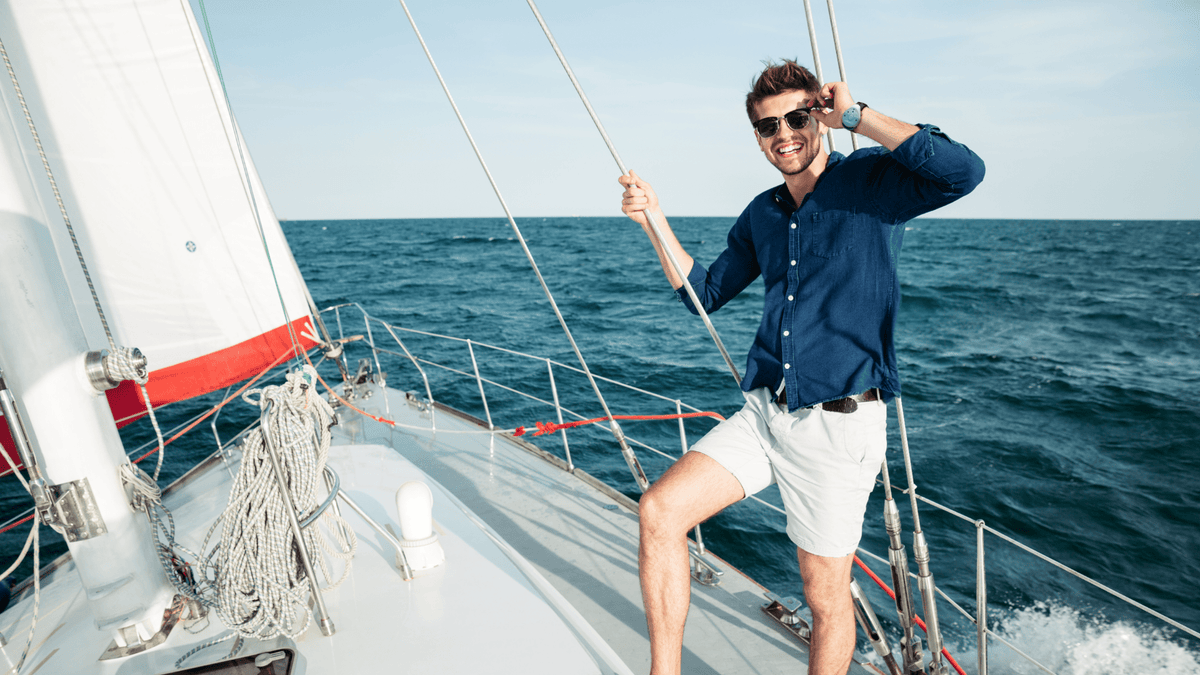 Man on a boat smiling while wearing reliefband to treat motion sickness